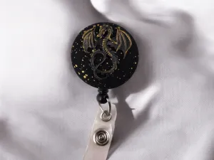 Black and gold dragon badge reel